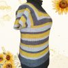 Side view of the Sunflower Road Tee on a mannequin, showing the short sleeve and the stripes of mustard yellow, charcoal grey and light grey, with sunflowers in the background.