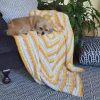 whatcha-ma-call-it blanket/afghan draped over a chair