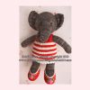 Hand-knitted elephant toy in grey yarn, featuring large ears, a long trunk, and black button eyes. Dressed in a red and white striped top with matching red shoes and floral accents. A whimsical, handmade stuffed animal designed by Heidi Bears—perfect for nursery decor, gifting, or collectors of artisanal knit toys.