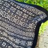 Close up of Knitted baby blanket with detailed star motifs in contrasting colours, made using the Etoile Baby Blanket Kit designed by Heidi Bears.